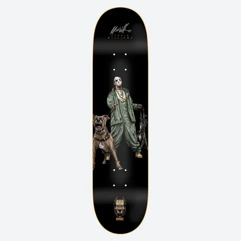 DGK Canine Stevie 8.06 skateboard deck: Illustrated man in a white mask and green bomber and trousers, with gold chains, walking two snarling pit bull dogs on leads. Stevie Williams signature at the nose and a DGK dog head logo at the tail on black.