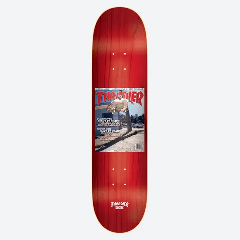 DGK x Thrasher McBride 8.25 skateboard deck: Red-stained deck with a reproduction of a Thrasher magazine cover in the centre, showing a skater grinding a ledge outside a building. Cover lines list places and music. Thrasher and DGK logo at the tail.