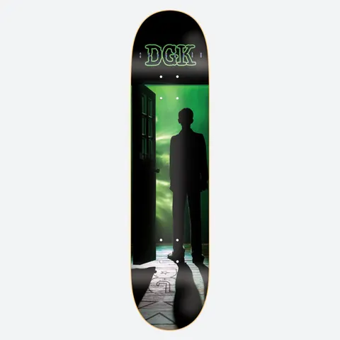 DGK Files Shanahan 8.38 skateboard deck: Black silhouette of a man standing in a doorway opening onto a glowing green sky, with a long shadow stretching across a pale floorboard marked with a faint logo. Outlined DGK lettering sits at the top.