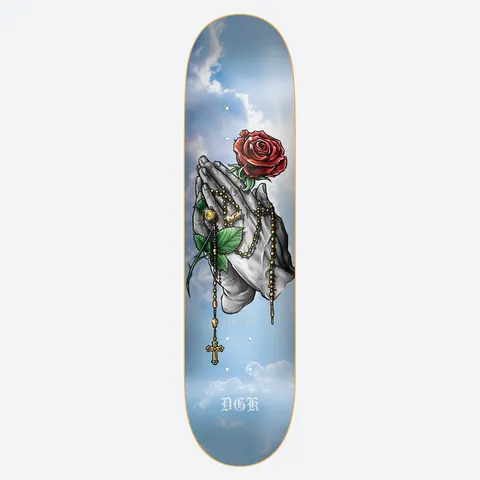 DGK Glory skateboard deck: Realistic illustration of praying hands holding a gold rosary and a red rose with a green stem, set against a blue sky with soft clouds. DGK in old English lettering near the bottom.