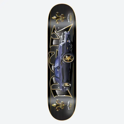 DGK Gris Gris Vaughn skateboard deck: Dark blue lowrider-style car with gold wheels in the centre of a black deck, flanked by large gold DGK letters and fleur-de-lis emblems. Gold outlines and small gold text frame the design.