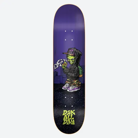DGK Martian 8.25 skateboard deck: Cartoon green alien in a black hoodie, DGK cap and camouflage trousers, smoking and exhaling smoke shaped like a DGK logo, standing before city buildings on a purple deck. DGK All Day logo at the bottom.