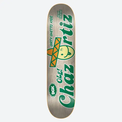DGK Ole! Ortiz 8.1 skateboard deck: Green and orange logo-style lettering reading Chaz Ortiz, with a smiling yellow face wearing a sombrero in place of the O. A DGK star burst and small Dirty Ghetto Kids and All Day Everyday text on a natural wood deck.
