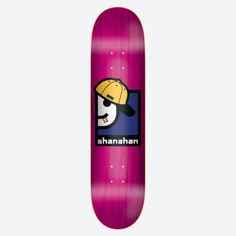DGK Thrift Shanahan skateboard deck: A cartoon character with a yellow backwards DGK cap, sunglasses and a gold tooth sits within a navy and black square, above the rider's name in blocky white text. Pink stained deck.