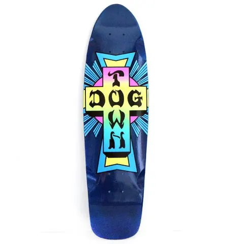 Dogtown Cruiser Mini Neon Cross Logo Color x skateboard deck: A large Dogtown cross logo in black blackletter lettering, filled with a neon pink, yellow and cyan fade, with blue light rays behind it, on a glossy dark blue cruiser shape.