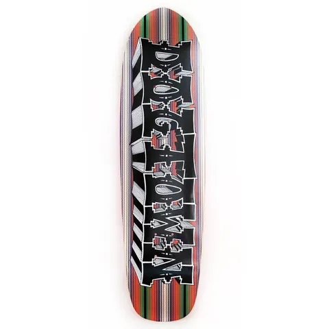 Dogtown Mexican Blanket Cruiser skateboard deck: Chunky black Dogtown lettering with a white hatched 3D edge and Southwestern-style red patterns inside, laid over a vertically striped Mexican blanket pattern in orange, red, green and cream. Cruiser shape with a rounded nose.