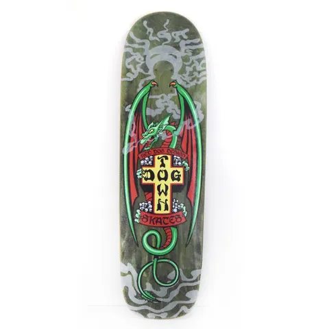Dogtown Red Dog Smoking Dragon 9 x skateboard deck: Shaped deck with a green dragon with red wings coiled around the yellow Dogtown cross, with ribbon banners and small skulls, over grey swirling smoke on a dark green stain.