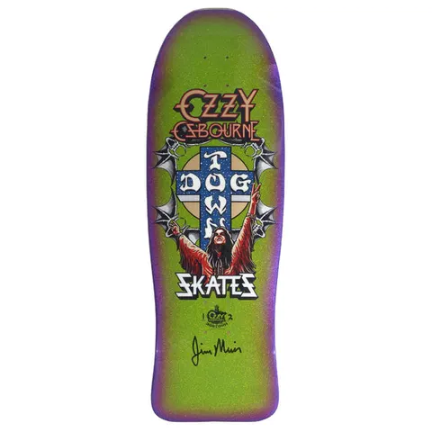 Dogtown Limited Dogtown Ozzy Osbourne - x - Gecko Green / Lavender / Purple Fade skateboard deck: Old-school shaped deck with a heavy-metal-style portrait of a long-haired figure with arms raised in front of the Dogtown cross, flanked by bat wings and chains. Ozzy Osbourne logo above, Skates below, with a signature at the bottom.