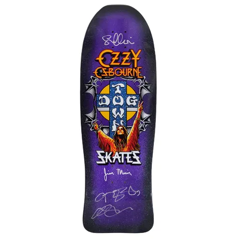 Dogtown Signed Limited Dogtown Ozzy Osbourne - x - Purple Flake / Black Fade skateboard deck: Rock singer with arms raised in peace signs beneath the Dogtown cross logo, framed by winged bat-like ornaments, with Ozzy Osbourne logo above and Skates below, on a purple flake black fade old-school shape covered in silver signatures.