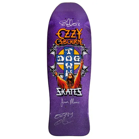 Dogtown Signed Limited Dogtown Ozzy Osbourne - x - Purple Flake skateboard deck: An old-school shaped purple flake deck with orange Ozzy Osbourne lettering above a blue Dogtown cross on a gold disc, spiked bat-wing details, and a long-haired figure with raised arms. Skates lettering and silver signatures are below.