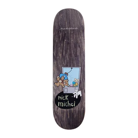 Frog Claw Machine (Nick Michel) skateboard deck: Cartoon claw machine with a teddy bear in a blue cap being grabbed, small toys inside and a white terrier dog beside it, over a black oval with 'nick michel' in hand-drawn lettering on a dark stained deck.