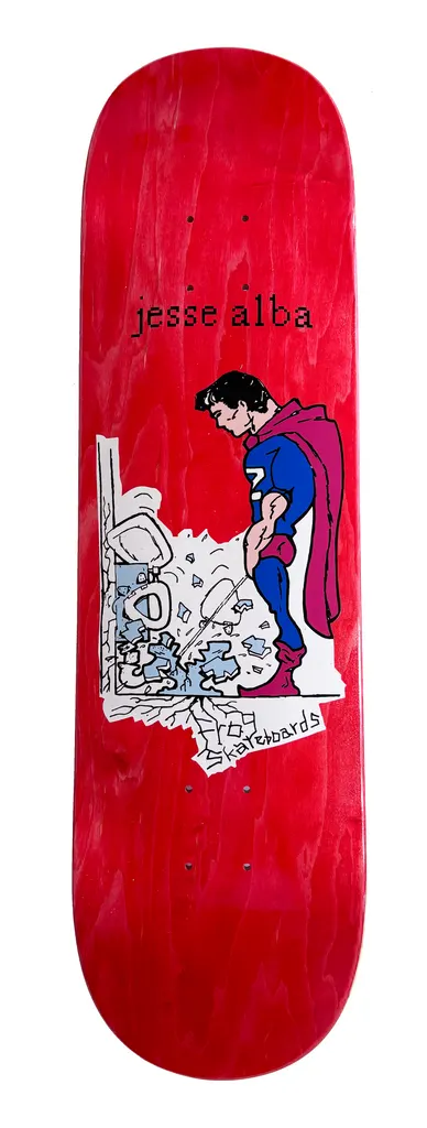 Frog Powerful Stream - Jesse Alba skateboard deck: Comic-style superhero in blue suit and magenta cape standing over a broken white toilet and pipes, urinating. Red stained deck with the rider's name at the top and a small handwritten logo.