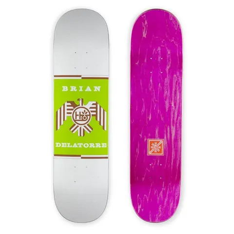 Habitat Dela Raptor Terratone skateboard deck: Green rectangle on a silver deck bearing a brown eagle emblem with a circular Habitat logo at its centre, with the name Brian Delatorre in white capitals above and below. The other deck shown has a purple stained underside with a small logo.