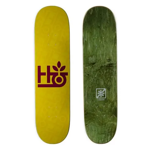 Habitat Monopod Embossed skateboard deck: Mustard yellow deck with a maroon Habitat logo of stacked H and G shapes topped by a sprouting leaf, over a faint embossed repeat of the same logo. Green-stained underside with a small emblem shown beside it.