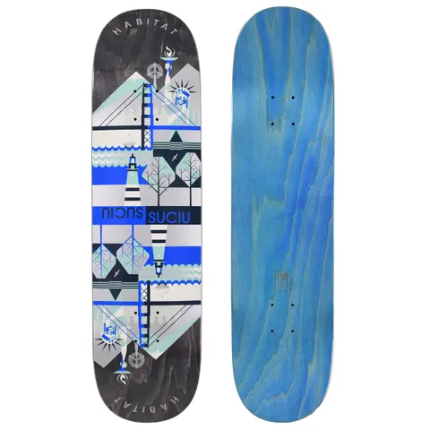 Habitat Suciu Twin Continental skateboard deck: A mirrored, geometric design of landmarks including the Statue of Liberty, a suspension bridge, a lighthouse and trees, in blue, grey and silver bands on a black-stained deck. 'Suciu' appears twice, once reversed, with Habitat curved at both ends. The photo also shows the blue underside.