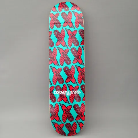 Insane Stanley Bird skateboard deck: Repeating all-over pattern of red stylised birds with grey beaks and dark patterned bodies on a turquoise background, with a small white Insane logo and rider name near the tail.