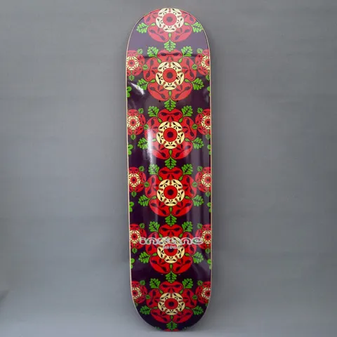 Insane Tudor Rose skateboard deck: Dark purple deck covered in a repeating column of stylised red Tudor roses with cream centres and green leaves, with a small Insane logo mid-deck.
