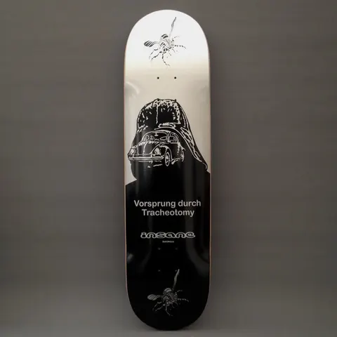 Insane Vorsprung Durch Tracheotomy skateboard deck: Silver-to-black deck showing a Volkswagen Beetle inside the outline of a dark helmeted figure, with two flies at the top and bottom. The title and the brand logo are printed in grey in the lower half.