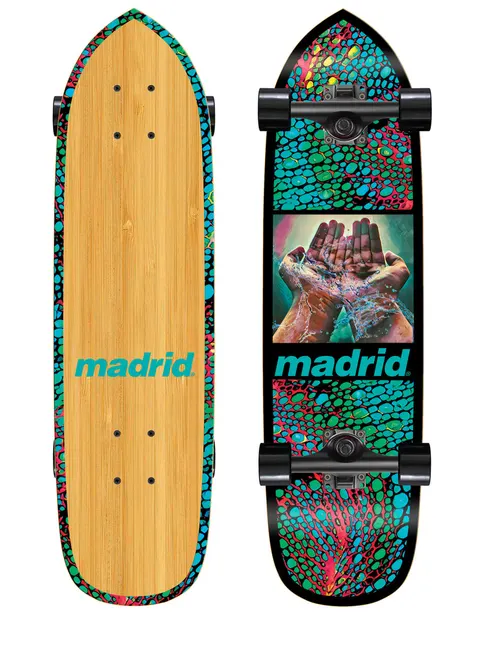 Madrid 76 27 skateboard deck: Cruiser-shaped board with a teal, red and green cellular pattern border, and a framed painting of cupped hands holding splashing water. Madrid logo in teal beneath, on black, with a bamboo underside.