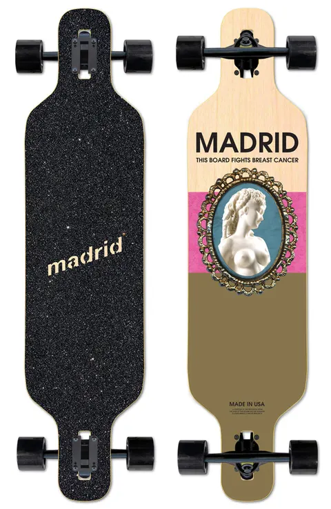 Madrid Breast Cancer Relief - Dream 39 skateboard deck: Cameo-style portrait of a white marble bust of a woman in an ornate gold oval frame on a blue ground, over pink and olive colour blocks on natural wood. Madrid name and 'This board fights breast cancer' above. Complete longboard shown from top and underside.