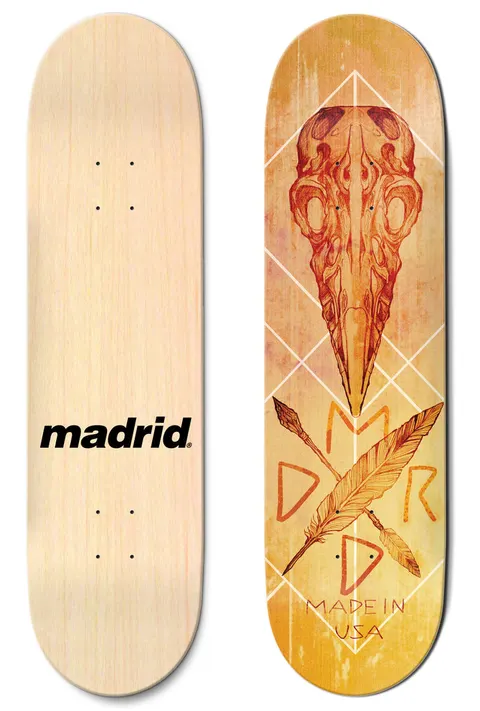 Madrid Crow 8 skateboard deck: Orange-toned drawing of a bird skull above a crossed feather and arrow, with diamond line patterns behind, on a yellow-orange distressed background. Photo shows the plain natural bottom with a Madrid logo too.