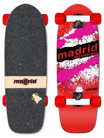 Madrid Retro Explosion Red skateboard deck: A red cruiser deck with a splattered pink and white paint pattern and the Madrid Skateboards name in black capitals across a torn black band. The photo shows the top with red wheels and the griptape side with a Madrid logo strip.