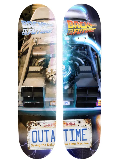 Madrid X Back to the Future - OUTATIME Split Series 8.25 skateboard deck: Two decks side by side forming one image of the front of a DeLorean time machine with its engine and a California licence plate reading 'OUTATIME'. Back to the Future logo at the top of each, one in silver, one in orange and red, with blue electric effects.
