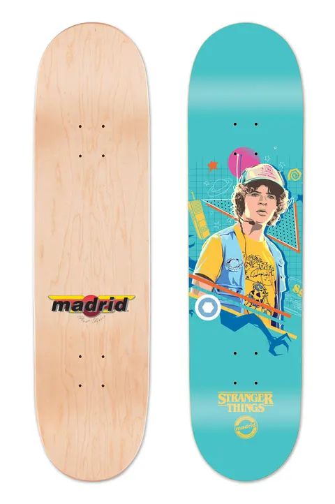Madrid X Stranger Things 3 - Dustin Blue 8 skateboard deck: Teal deck with a stylised illustration of a curly-haired boy in a cap and yellow t-shirt with a denim vest, set among retro 80s shapes, a walkie-talkie and a pink planet. Stranger Things and Madrid logos sit at the bottom.