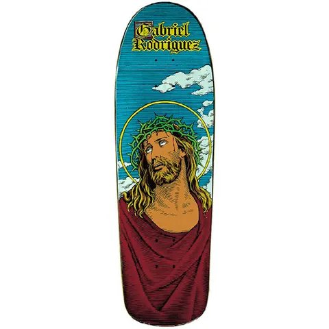 101 Gabriel Rodriguez Jesus skateboard deck: A bearded man with long hair, a crown of thorns and a gold halo, in a red robe, looking upward against a blue sky with white clouds. The rider's name is in gold blackletter at the top of the deck.
