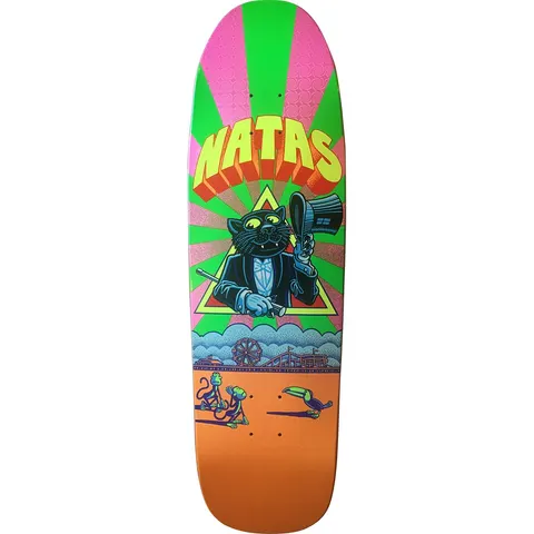 101 Natas Kaupas Zap cat (foil swirl background) skateboard deck: A black cat in a tuxedo lifting a top hat inside a yellow triangle, under 3D yellow-and-orange NATAS lettering and a green and pink sunburst. Below, monkeys and a toucan near a seaside pier with a Ferris wheel, on an orange base.