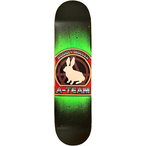A-Team Rodney Mullen Crest skateboard deck: Round crest showing a cream rabbit silhouette over a dark anarchy-style A symbol, framed in red and orange with chrome lettering. Set on a black deck with a bright green airbrushed glow.