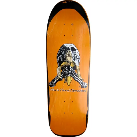 Blind Mark Gonzales Skull and Banana skateboard deck: A white skull with skeletal hands peeling and eating a banana, drawn in black line with yellow banana, above the name Mark "Gonz" Gonzales on an orange-stained old-school shape with black edges.