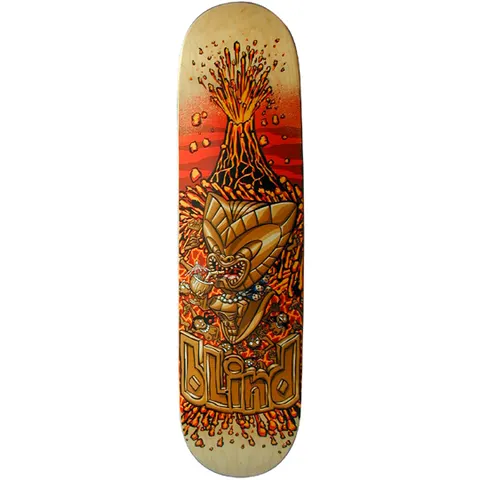 Blind Tiki skateboard deck: Golden tiki idol sipping a tropical cocktail in front of an erupting volcano, surrounded by lava and small skulls, on a natural wood deck with red-orange background. Blind logo in carved gold lettering at the bottom.