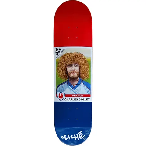 Cliché Charles Collet World Cup Series skateboard deck: Football sticker-card style portrait of a man with a large curly ginger afro and beard in a pale blue France shirt, with a World Cup 2014 logo and a cockerel badge. The deck is red at the top and blue at the tail.