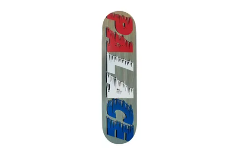 Palace Fast Grey Team Board skateboard deck: Grey ribbed-look deck with large Palace lettering set vertically, split into red, white and blue sections, each with dripping, speed-streak edges.
