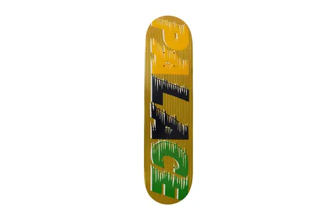 Palace Fast Team Yellow Board skateboard deck: Large stacked Palace letters in yellow, black and green, sliced with speed-line streaks and drips, over a gold deck with fine vertical stripes.