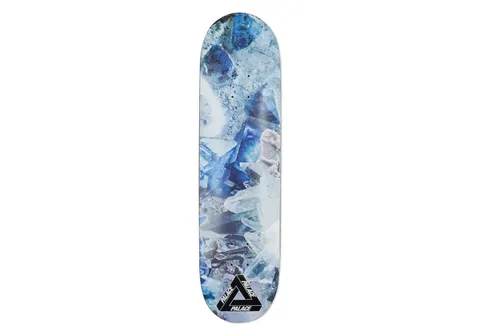 Palace Rocky 8.3 skateboard deck: Photograph of blue and clear quartz crystals and mineral formations covering the deck, with a black Palace tri-ferg logo at the bottom.