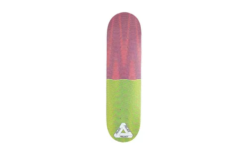 Palace Trippy Stick Three Board skateboard deck: Deck split in two halves with fine wavy horizontal lines creating a moire effect: pink, red and blue at the top, yellow-green at the bottom. White Palace triangle logo near the tail.
