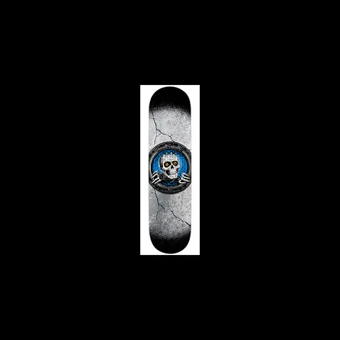 Powell Peralta Blue Pool Light Ripper skateboard deck: Cracked concrete-textured grey deck fading to black at the ends, with a round blue emblem of a white skull with yellow eyes and skeletal hands gripping the ring, around which the Powell Peralta name is written.