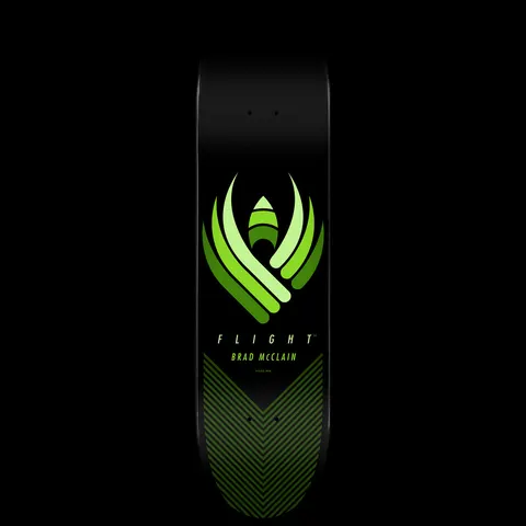 Powell Peralta Brad McClain Flight - Shape 243 skateboard deck: A stylised winged emblem of layered green curves around a small rocket shape, with FLIGHT and BRAD McCLAIN beneath and a chevron line pattern at the tail, on black.