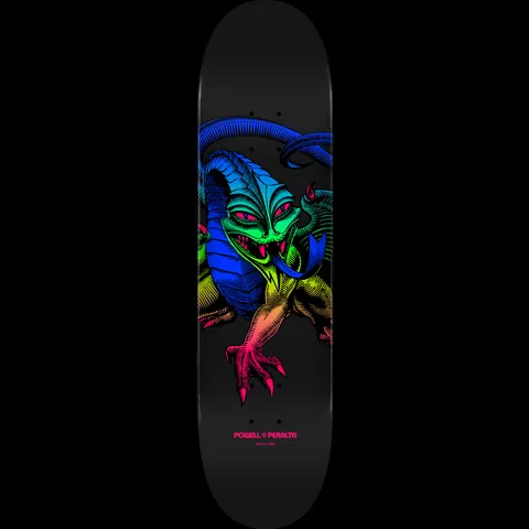 Powell Peralta Cab Dragon Green Fade - 245 K21 skateboard deck: Engraved-style dragon with a green head, blue horns and tail and a rainbow gradient body with pink claws, on a black deck with a small Powell Peralta logo.