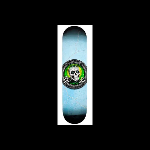 Powell Peralta Green Pool Light Ripper skateboard deck: Pale blue deck with a cracked, weathered texture and a round metal porthole at the centre showing a white skull with blue eyes and skeletal hands over a green and yellow glow. Powell Peralta signature across the top of the ring.