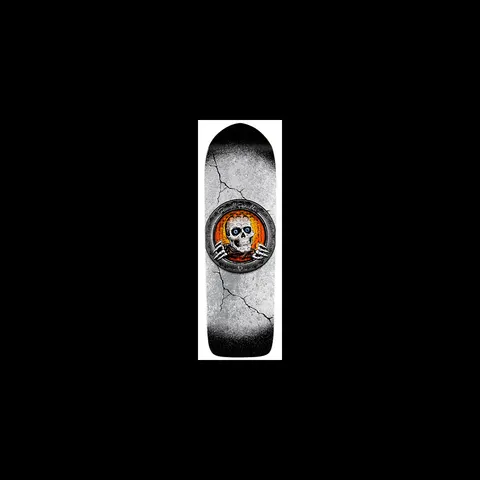 Powell Peralta Large Pool Light Ripper skateboard deck: A Ripper skull with skeletal hands gripping the edge of a round metal porthole-style frame, glowing orange behind it, set on a cracked concrete-textured grey deck fading to black at the nose.