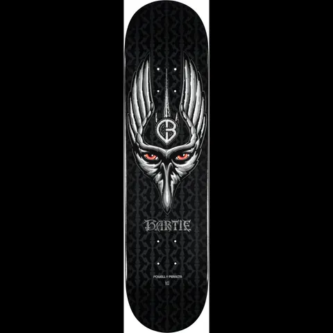 Powell Peralta LIGAMENT Pro Chad Bartie Crow 2 skateboard deck: A silver, winged crow's head with glowing red eyes and a CB monogram on its forehead, on a black deck with a dark repeating gothic pattern. The name Bartie is lettered beneath in a blackletter style.