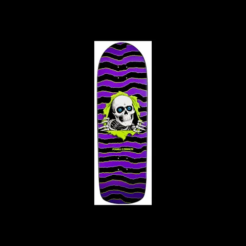 Powell Peralta Old School Ripper Purple skateboard deck: A white skull with blue eyes and skeletal hands tears through a lime green ripped hole, over wavy purple and black torn-paper bands edged in lime. The Powell Peralta logo sits beneath.