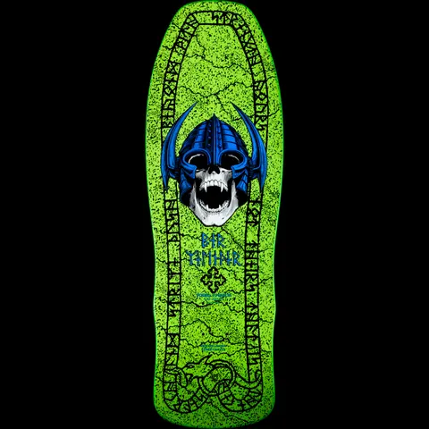 Powell Peralta Per Welinder Nordic Skull Green skateboard deck: A white skull in a blue horned Viking helmet with its mouth open, on a cracked lime green stone-effect deck bordered by a runic inscription and a serpent at the tail. Welinder's name in runes and a Celtic cross sit beneath.