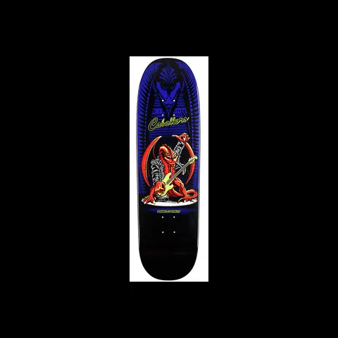 Powell Peralta Pro Caballero Guitar Dragon skateboard deck: A red dragon in a leather jacket plays a bass guitar on stage, under a dark blue winged dragon-head motif, with the rider's name in yellow-green script, on a blue-to-black deck.