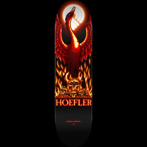 Powell Peralta Pro Kelvin Hoefler Phoenix - Shape 248 skateboard deck: A red and orange phoenix with raised wings rises from flames over a pile of skulls, in front of a glowing pale sun, on a black deck. HOEFLER in glowing red letters and Powell Peralta text sit below.
