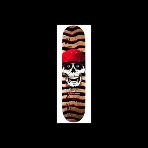 Powell Peralta Pro Steve Caballero Hooligan skateboard deck: A grinning white skull with blue eyes wears a red flat cap, over a black, red and tan wavy striped background, with a signature and Powell Peralta logo below.