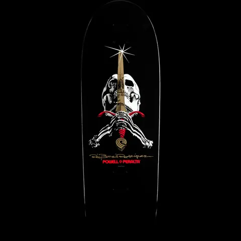 Powell Peralta Ray Rodriguez Skull and Sword Black skateboard deck: A white skull with a gold sword down its centre and skeletal hands gripping a red-guarded hilt, with a gold signature and Powell Peralta logo below, on a black deck.